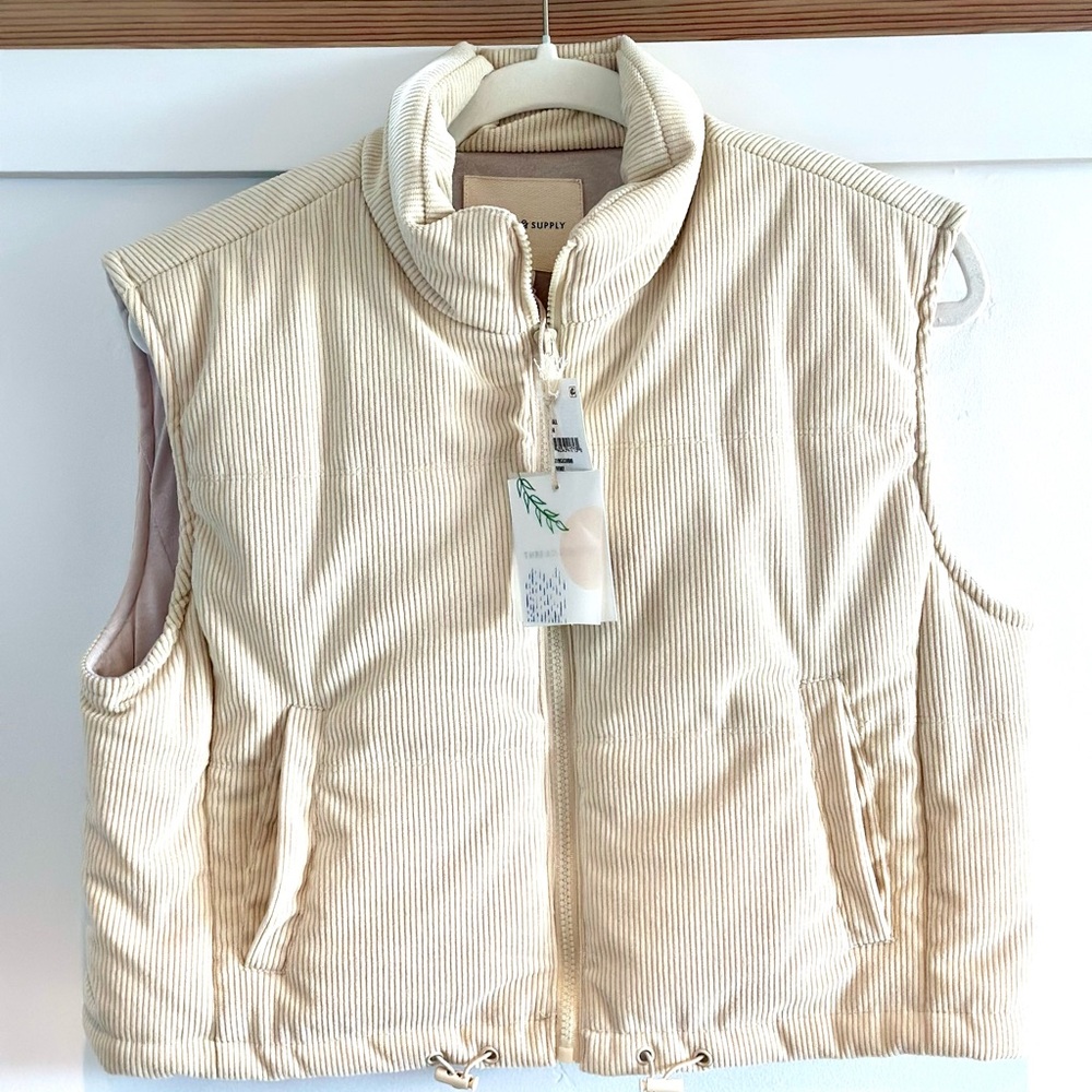 Thread and supply cream colored corduroy puffer vest.